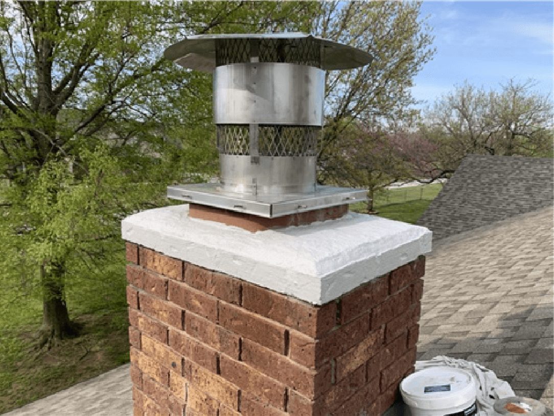 Chimney Crown Repair with chimney cap and bucket at bottom of chimney