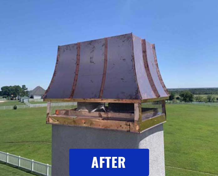Beautiful custom chimney cap after installation with pond and field with white fencing in background along with a house
